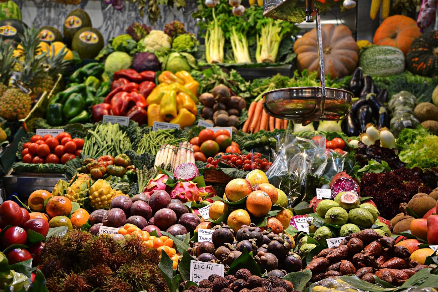 A market stall stacked with fresh fruit and vegetables